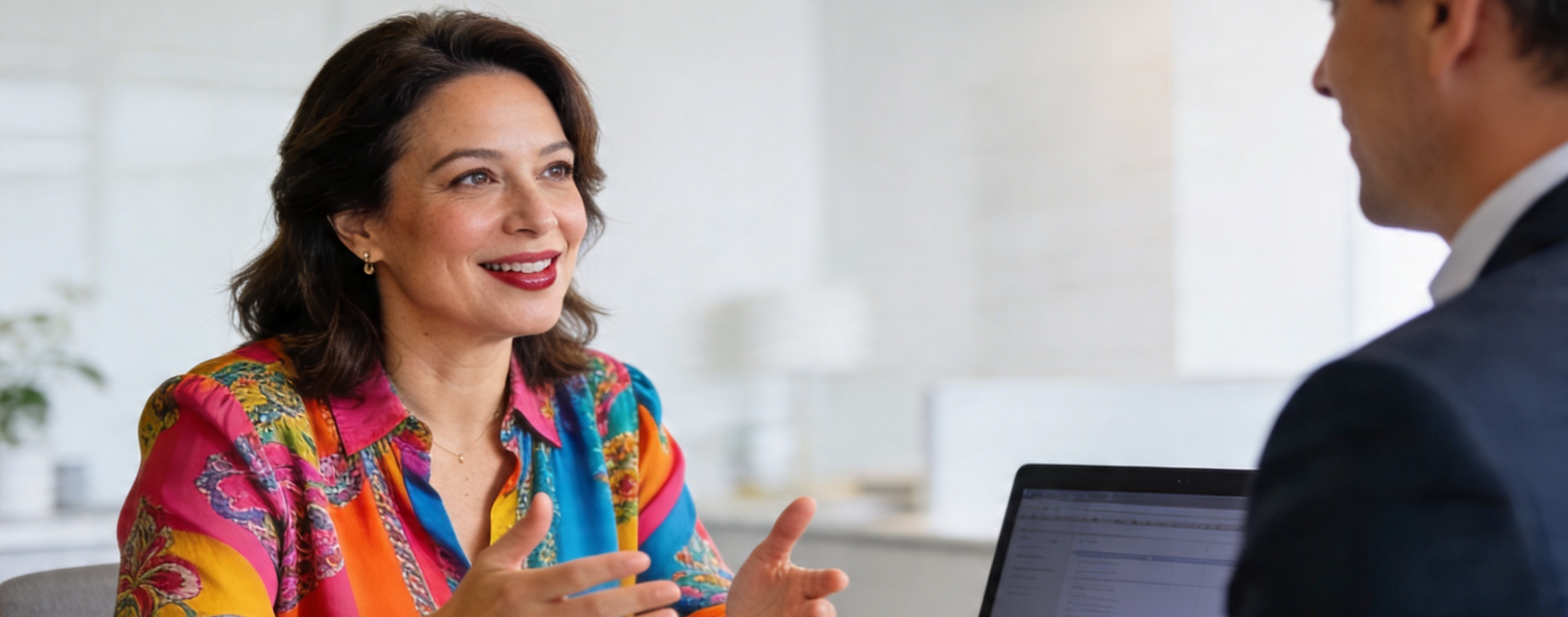 woman client explaining her goals to her financial advisor
